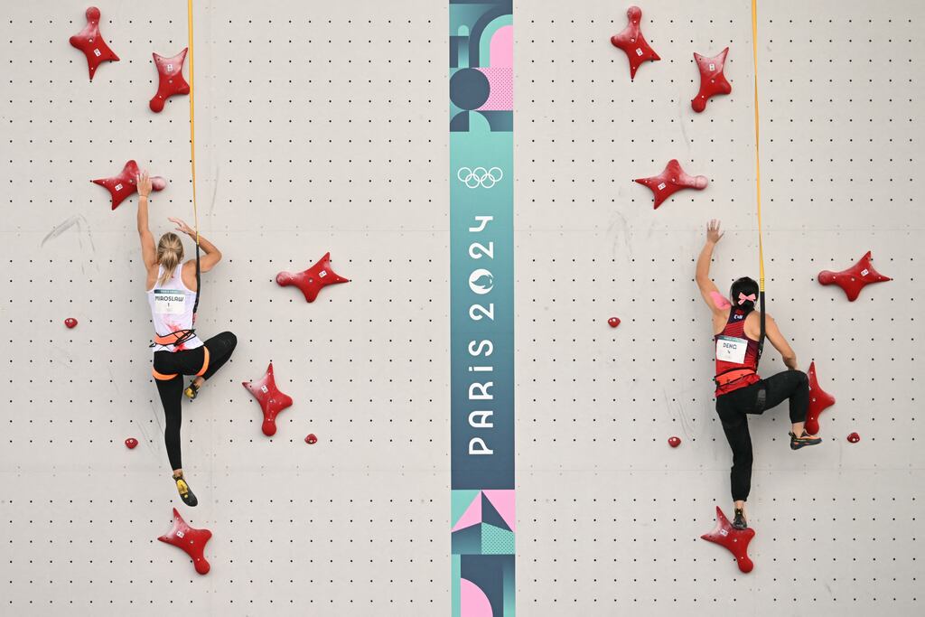 Poland's Aleksandra Miroslaw competes against China's Lijuan Deng in the women's sport climbing speed final. Photograph: Jonathan Nackstrand/AFP via Getty