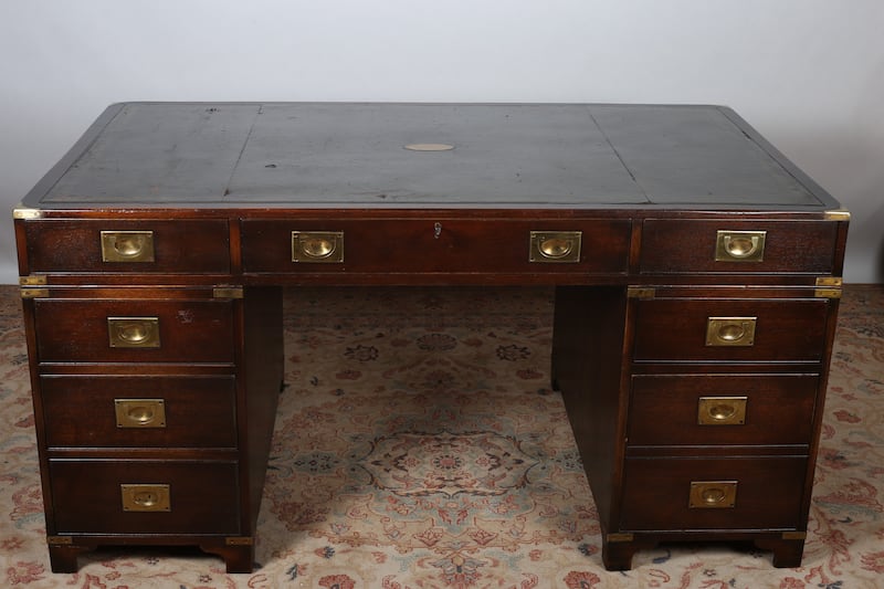 Vintage mahogany and brass bouind military desk €800-€1.200.