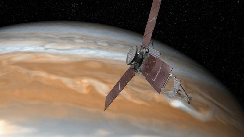 An undated image provided by Nasa of a rendering of the Juno spacecraft passing over Jupiter. After traveling for nearly five years and about 2 billion kilometers, Nasa’s Juno spacecraft is expected to announce its arrival at Jupiter on July 4th, 2016. The New York Times