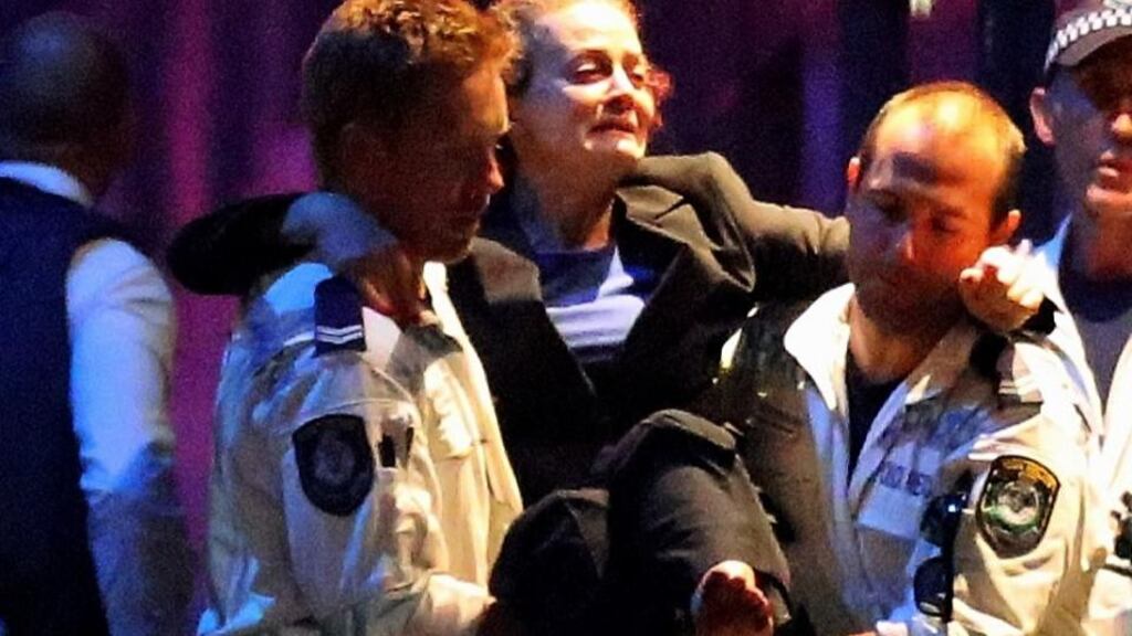 Above, a woman is carried out by police from the Lindt Cafe, Martin Place following a hostage standoff on December 15th, 2014 in Sydney, Australia. Police stormed the Sydney cafe as a gunman had been holding hostages for 16 hours. Photograph: Joosep Martinson/Getty Images