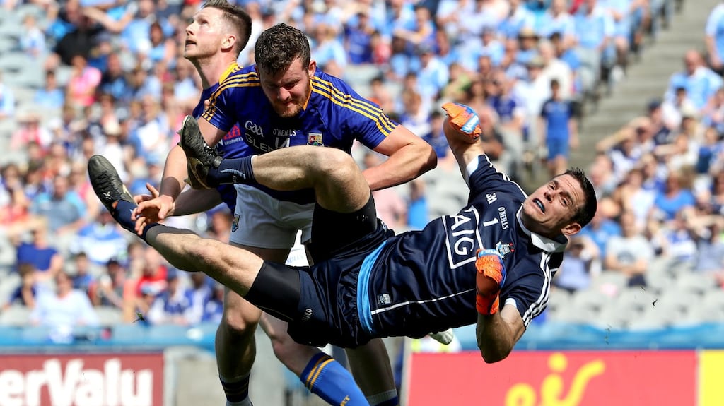 Dublin’s Stephen Cluxton is fouled by James McGivney of Longford. Photograph: Bryan Keane/Inpho
