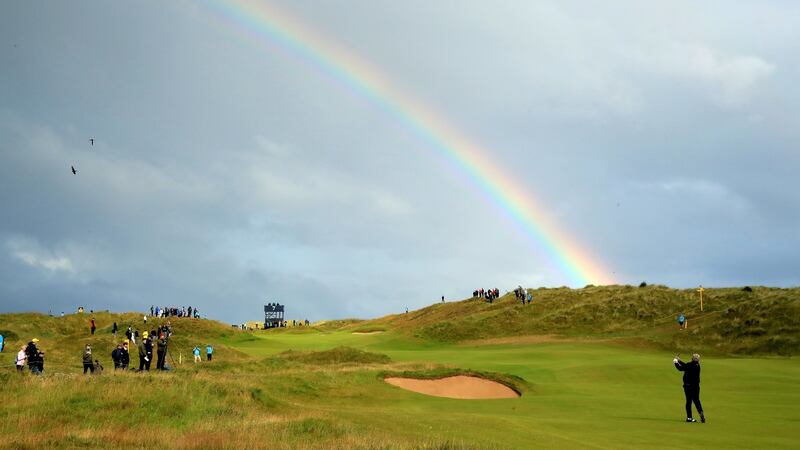 Darren Clarke of the Northern Ireland plays his second shot on the seventh hole during the first round Open Championship. Photograph: Andrew Redington/Getty Images
