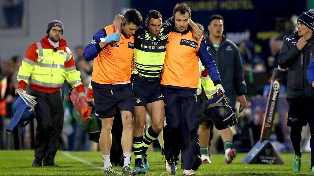 Dave Kearney goes off injured during Leinster’s Pro12 clash with Connacht. Photo: Ryan Byrne/Inpho