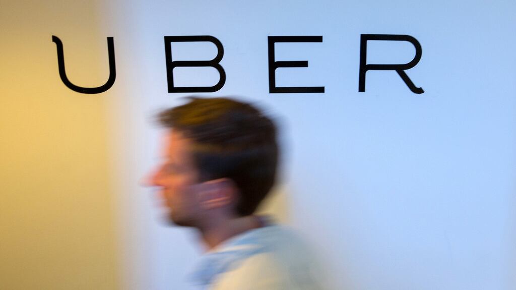 A logo sits on the wall inside the offices of Uber Technologies. Photograph: Krisztian Bocsi/Bloomberg