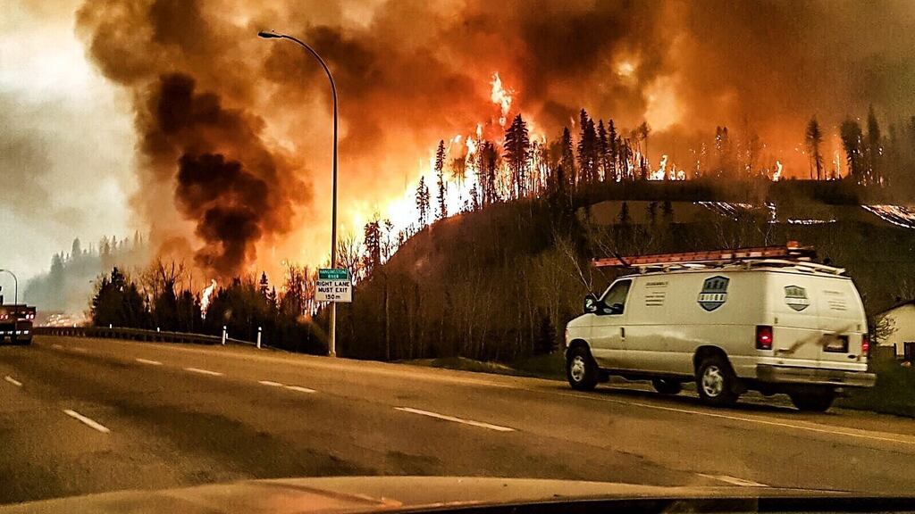A picture provided by Twitter user @jeromegarot shows a wildfire raging through the town of Fort McMurray, Canada, on Tuesday. Photograph: EPA/Twitter/Jerome Garot