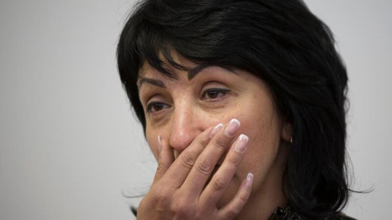 Yelena Rybak, widow of Batkivschyna party member Volodymyr Rybak, speaks to the media in Donetsk on Wednesday after the discovery of her husband’s body. Photograph: AP/Alexander Zemlianichenko