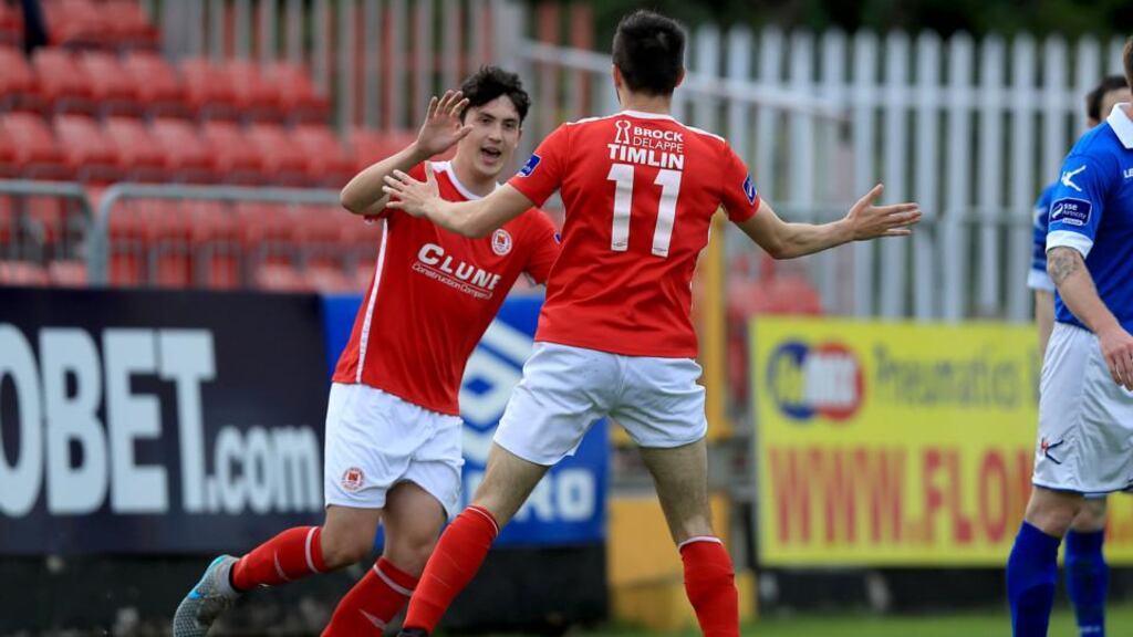 Mark Timlin celebrates scoring the first goal of the game with his St Patrick’s Athletic team-mate Jamie McGrath during the SSE Airtricity League Premier Division match against Finn Harps at Richmond Park. Photograph: Donall Farmer/Inpho