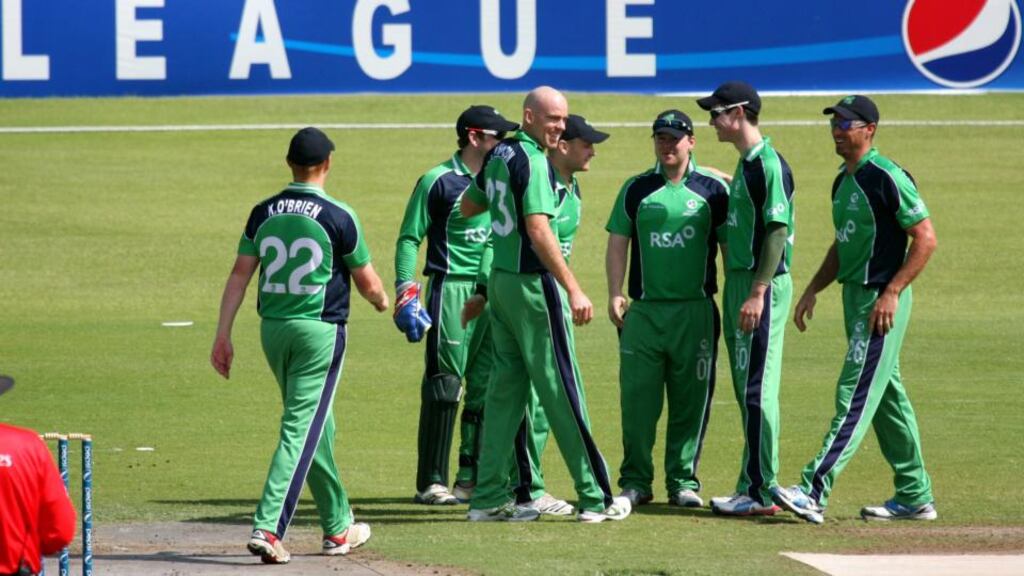 Trent Johnston (third from left) is congratulated by his Ireland team-mates after taking a wicket in the World Cup qualifier against the UAE in Sharjah. Photograph: Barry Chambers/ICC/Inpho
