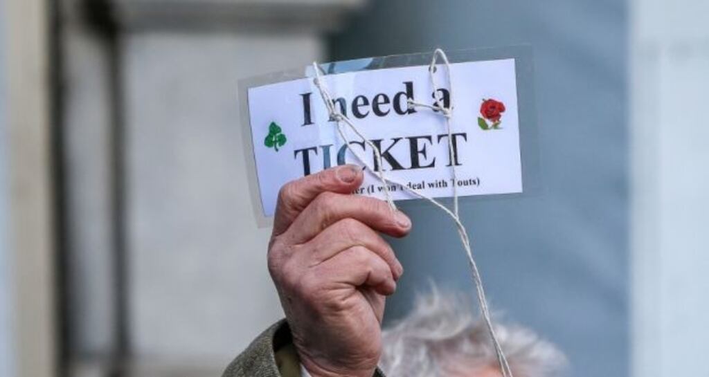 A fan looking for a ticket before Ireland’s Six Nations match against England at the Aviva Stadium. Photograph: Gary Carr/Inpho