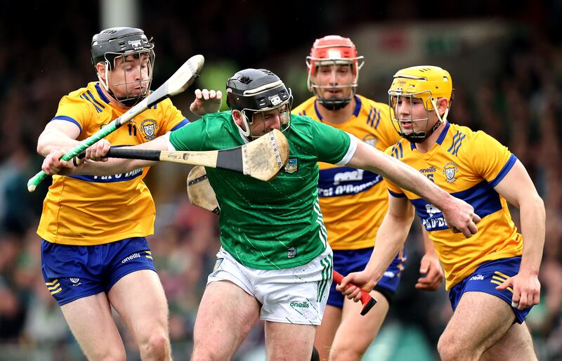 Clare's Tony Kelly tackles Declan Hannon of Limerick during the titanic clash at the TUS Gaelic Grounds. Hannon remains one of Limerick's key figures. Photograph: Bryan Keane/Inpho