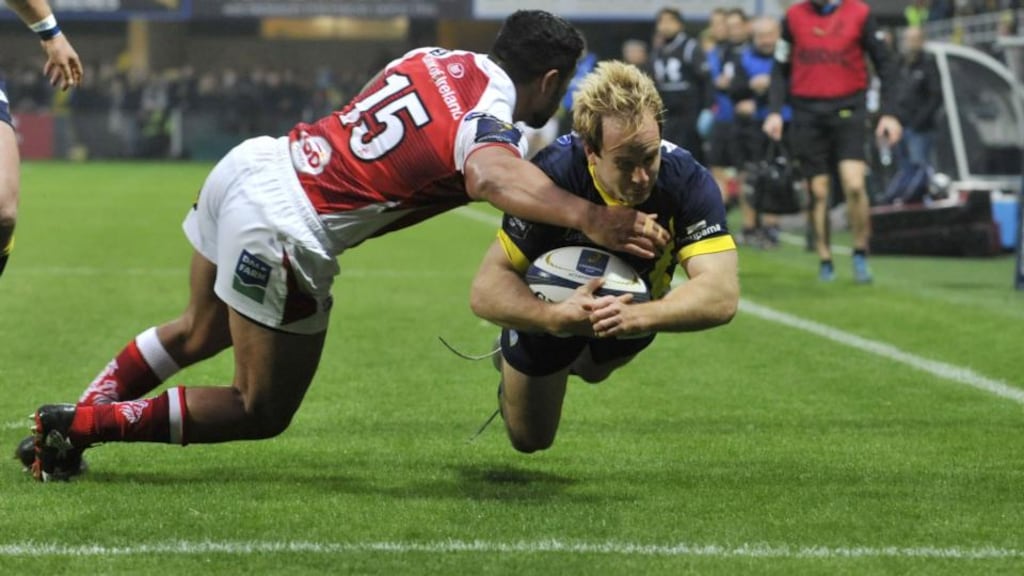 Clermont winger Nick Abendanon gets through the tackle of Ulster fullback Charles Piutau to score a try in the Champions Cup game at Stade Marcel-Michelin. Photograph: Thierry Zocolan/Inpho/Presseye/