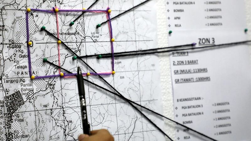 A police officer shows a rescue operation map for 15-year-old Irish girl Nora Quoirin during a news conference in Seremban, Malaysia on Wednesday. Photograph: Lim Huey Teng/Reuters
