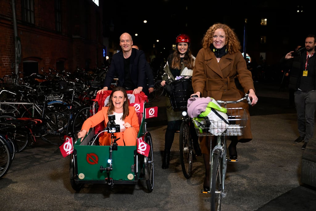 Red-Green Alliance: Pelle Dragsted drives Mai Villadsen (bottom left) on a cargo bike, along with Rosa Lund (front right), in Copenhagen, Denmark. Photograph: Nils Meilvang/Ritzau Scanpix/AFP via Getty Images