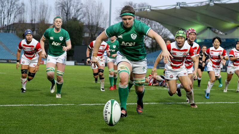Ciara Griffin pounces to score one of her brace of tries against Japan. Photograph: Dan Sheridan/Inpho