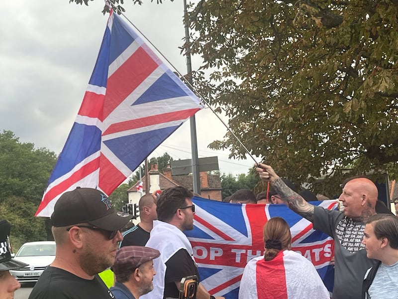 Locals in Epping celebrate after the council won a court case to have an asylum hotel shut down. Photograph: Mark Paul