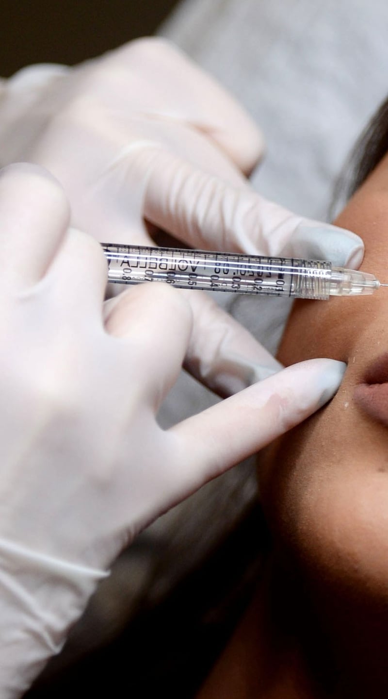 Instagram aesthetic: Alicja Puk injects a client at her clinic, in Blanchardstown in Dublin. Photograph: Alan Betson