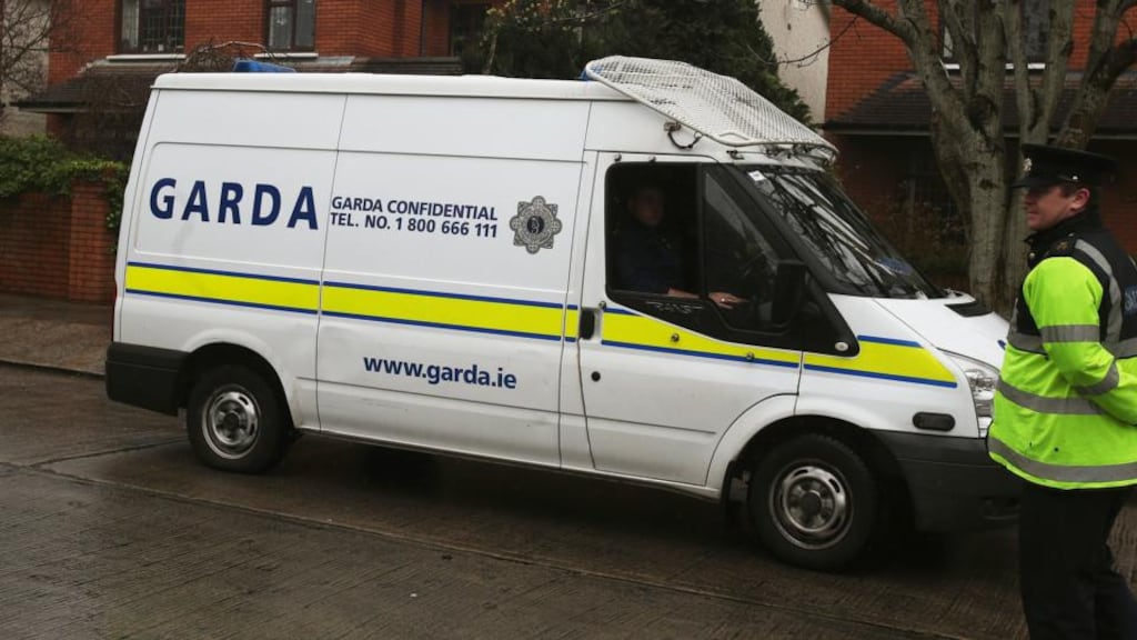 Gardaí outside the home of Minister for Justice Alan Shatter in Dublin, after Army bomb experts were called to deal with a package last week. Photograph: Brian Lawless/PA Wire