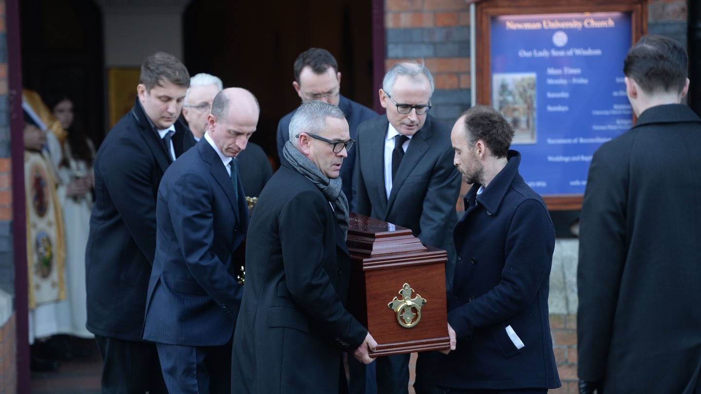 James McDermott (centre right in black tie and glasses) carries the remains of his brother Barrister Paul Anthony McDermott, assisted by other family members after the funeral mass at Newman University Church, St. Stephens Green in Dublin. Photograph: Alan Betson/The Irish Times