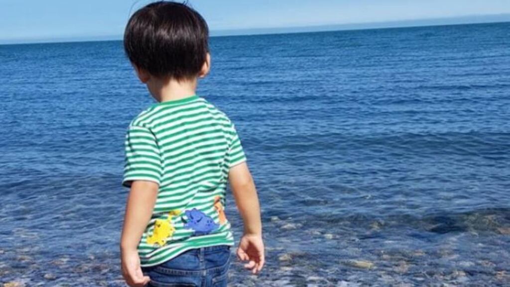 Throwing stones in the sea at Greystones #IrishTimesHappy
