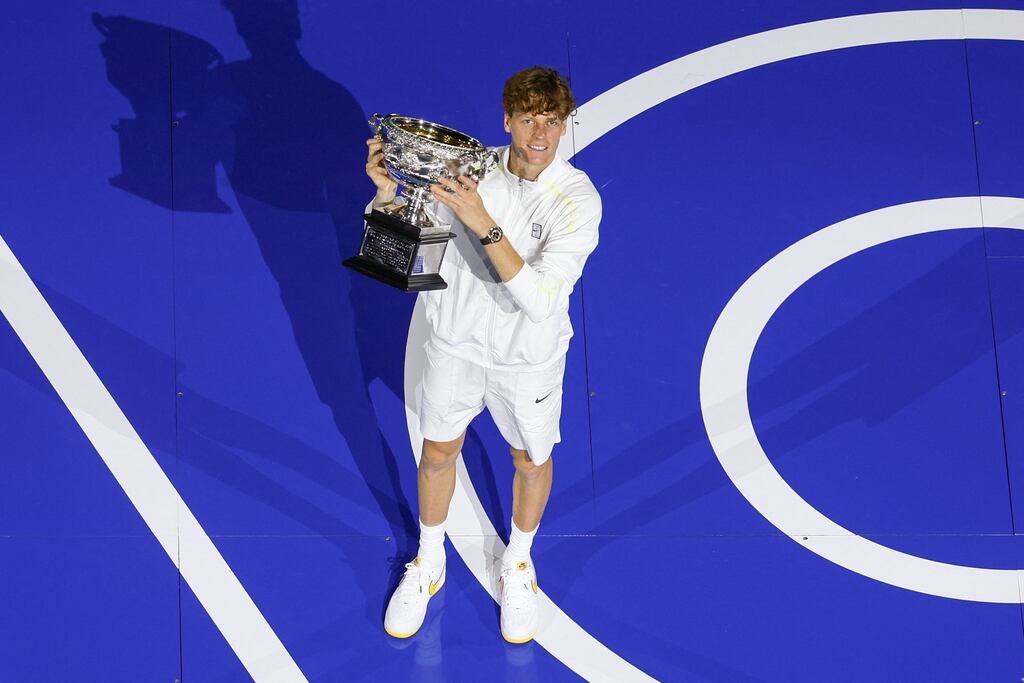 Italy's Jannik Sinner celebrates with the Norman Brookes Challenge Cup trophy after defeating Germany's Alexander Zverev during their men's singles final match at the Australian Open in Melbourne. Photograph: Adrian Dennis/AFP via Getty Images