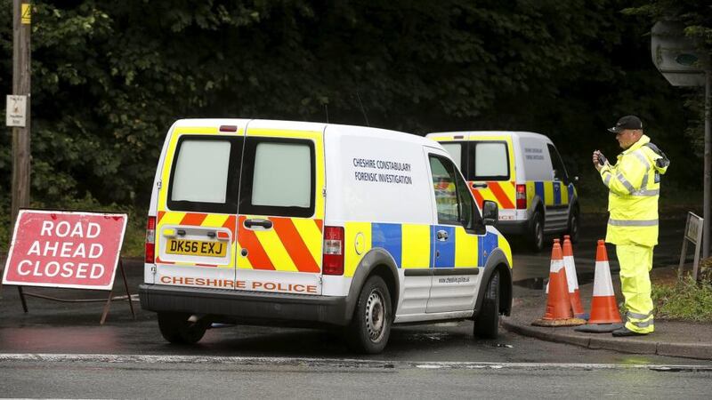 Police forensic vans arrive at the scene of an aircraft crash in Tarpoley, Cheshire, northwest England on Saturday. Photograph: Andrew Yates/Reuters