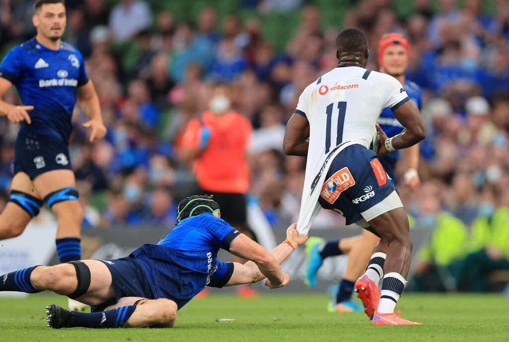 Blue Bulls Madosh Tambwe is tackled by Leinster's Ryan Baird. Photograph: Billy Stickland/Inpho