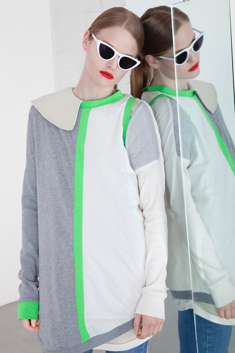 Single sleeve offset top with organic jersey and lime green panel €175, collared asymmetric top with organic jersey and denim €169, sunglasses Om Diva €32