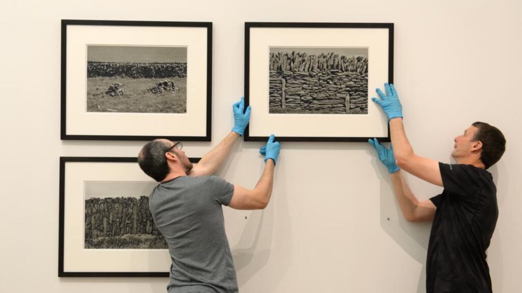 Art handlers prepare Aran 2005, a selection of black and white photographs which were part of an exhibition by artist Sean Scully at the National Gallery of Ireland in 2015. Photograph: Dara Mac Dónaill