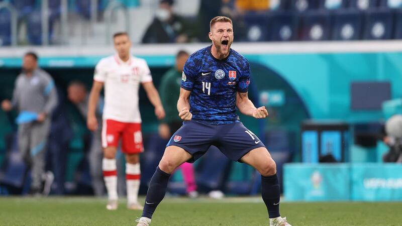 Milan Skriniar celebrates Slovakia’s 2-1 win over Poland. Photograph: Lars Baron/Getty
