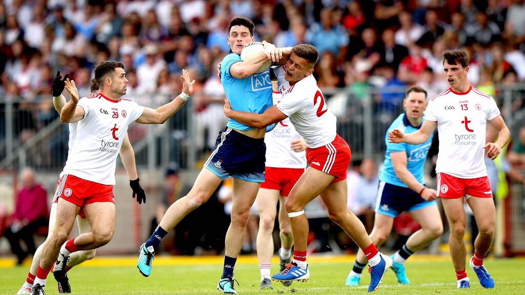 Diarmuid Connolly of Dublin and Tyrone’s Michael McKernan vie for possession in Healy Park, Omagh. Photograph: Ryan Byrne/Inpho