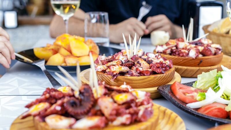 Food is part of almost every social occasion but under no circumstances should you dig in as soon as it lands. Photograph: iStock