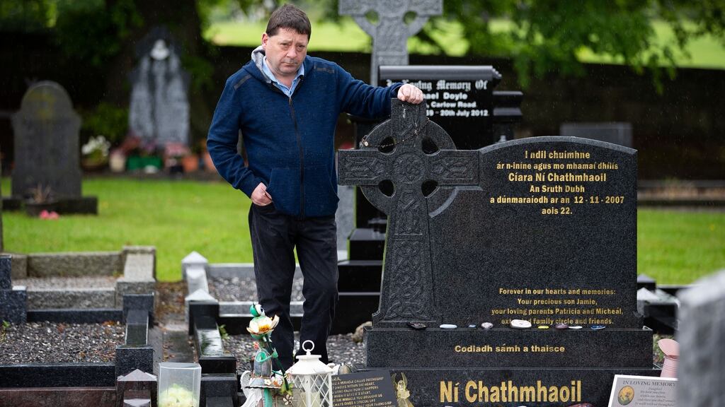 Micheál Cunningham at the Lismaconly Cemetery grave of his murdered daughter Ciara Ní Chathmhaoil. Photograph: Tom Honan