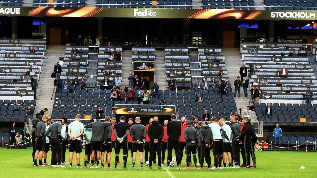 Ajax players hold a minute of silence to pay tribute to the victims of the Manchester terror attack. Photograph: PA