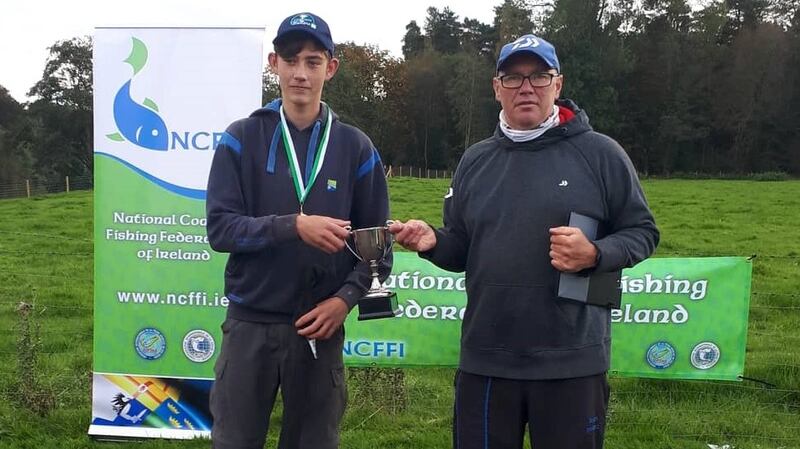 Charlie Richards, winner of U-15 Youth Feeder Championships on the Lower River Bann, receiving his prize from team manager Brenton Sweeney