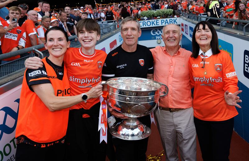 Armagh manager Kieran McGeeney celebrates with his wife Maura, son Cian and parents Pat and Brigid. Photograph: James Crombie/Inpho