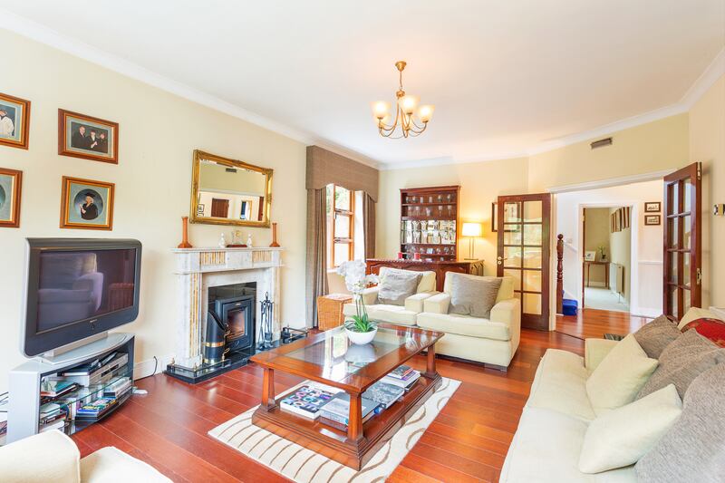 The main reception room at 11 Tresilian has a feature fireplace