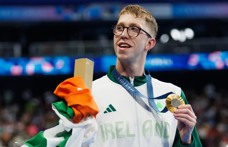 Daniel Wiffen celebrates with his gold medal after the 800m freestyle final. Photograph: James Crombie/Inpho