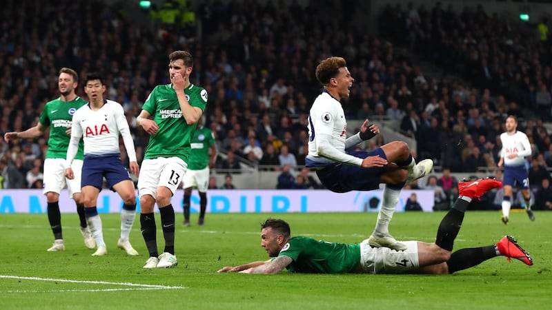 Shane Duffy tackles Dele Alli during Brighton’s late defeat to Tottenham. Photograph: Clive Rose/Getty