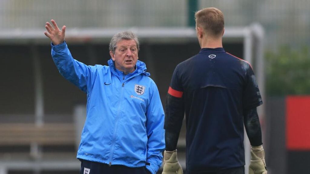 England Manager Roy Hodgson with goalkeeper Joe Hart during yesterday’s training session at London Colney, Hertfordshire.