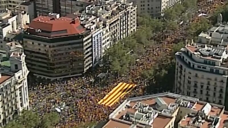 An image grab taken from a handout video released by the Spanish police shows an aerial view of protesters holding a giant Catalan flag during a pro-unity demonstration in Barcelona. Photograph: Spanish police/AFP/Getty Images