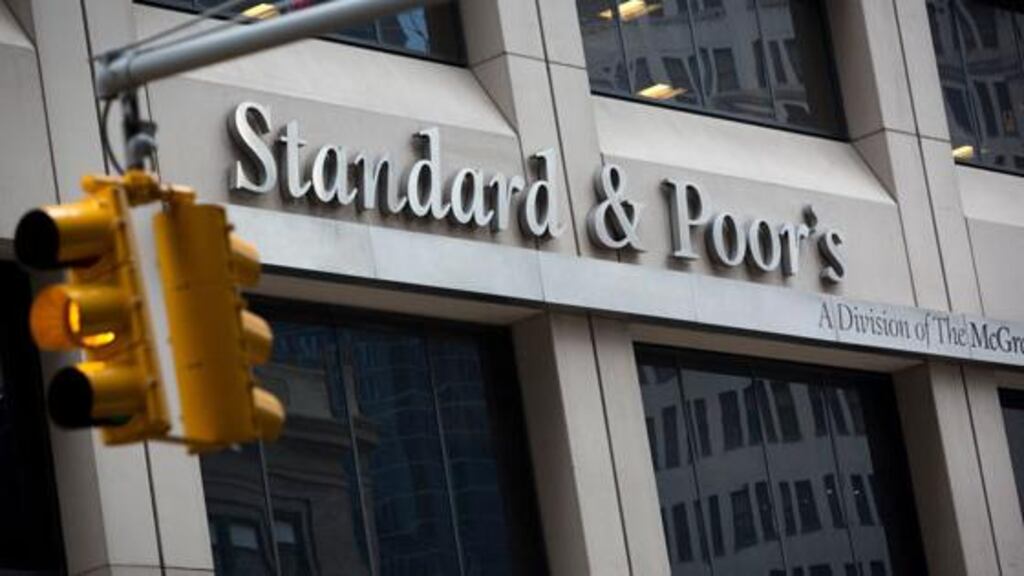 The Standard and Poor's logo is displayed at the company's headquarters in New York. The ratings agency is the first to improve their outlook on Irish debt since last week?s deal with the European Central Bank. Photograph: Scott Eells/Bloomberg