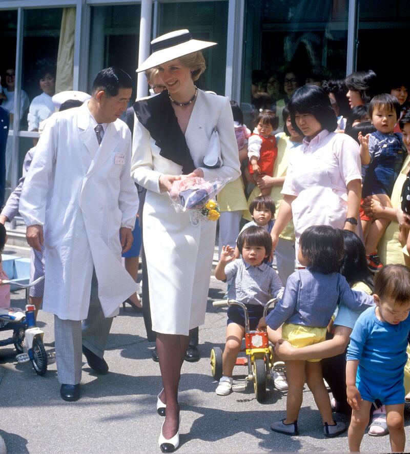 Japan, 1986: Diana, princess of Wales, at the Red Cross Infants’ Home in Tokyo. Photograph: John Shelley Collection/Avalon/Getty