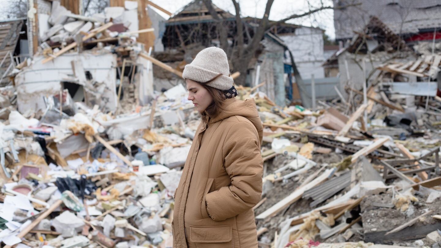 A woman passes by the rubble of housing destroyed by shelling on Saturday in Markhalivka, Ukraine. Regional police said six people died, including a child, while four were wounded in a Russian air strike on this village southwest of Kyiv. Photograph: Anastasia Vlasova/Getty