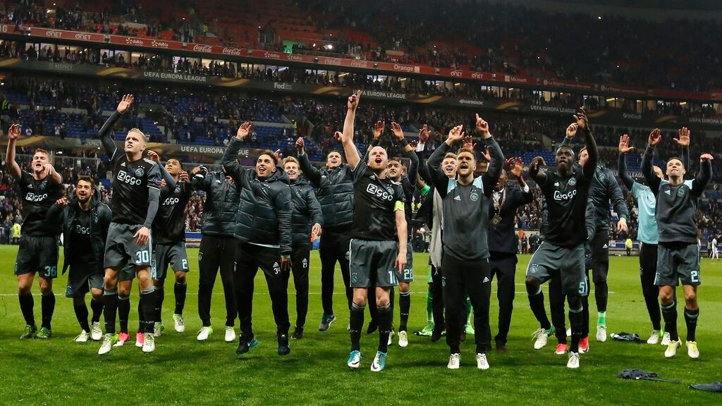 Ajax players celebrate after beating Lyon to reach the Europa League final. Photo: EPA