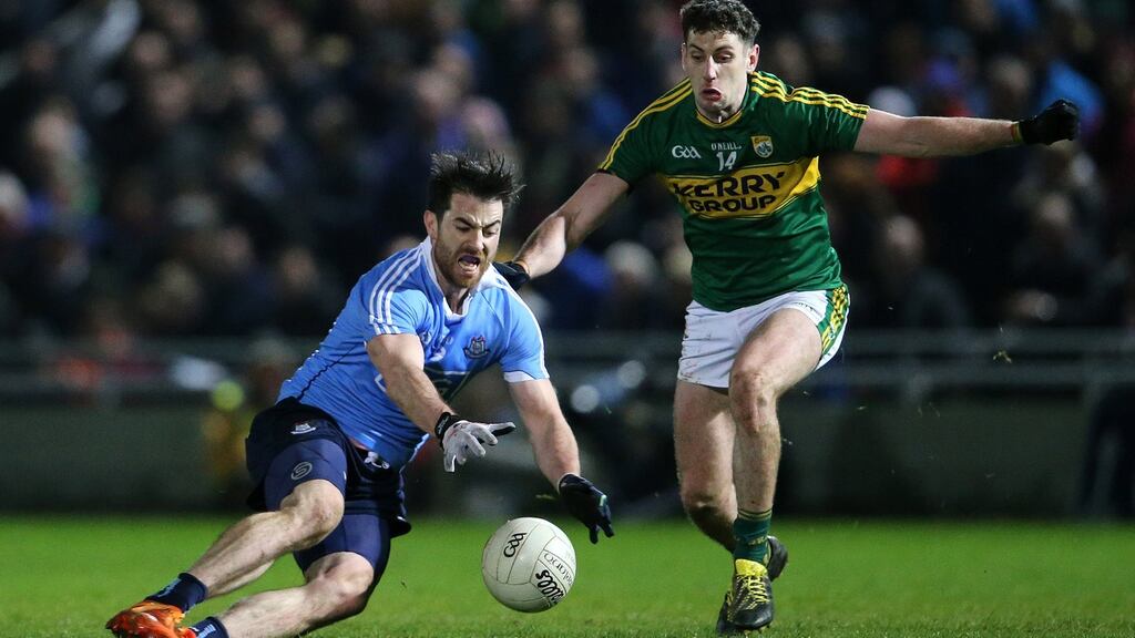 Kerry’s Paul Geaney tackles Michael Darragh Macauley of Dublin during Saturday’s draw in Tralee. Photograph: Cathal Noonan/Inpho