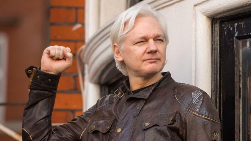 Julian Assange speaks from the balcony of the Ecuadorean embassy in London after an investigation by Sweden was dropped in 2017. Photograph: Dominic Lipinski/PA Wire