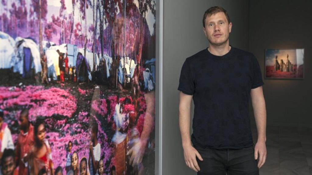 Irish photographer Richard Mosse poses during the presentation of his exhibition ‘The devil you know’. This will be his first individual exhibition in a Spanish museum and features pictures taken of the Democratic Republic of the Congo paramilitary groups. Photograph: Angelmedina G/ EPA