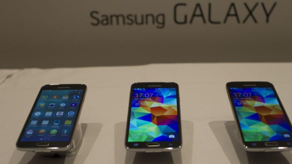 Galaxy S5 smartphones sit on display during a Samsung Electronics  news conference ahead of the Mobile World Congress in Barcelona, Spain. Photo: Bloomberg