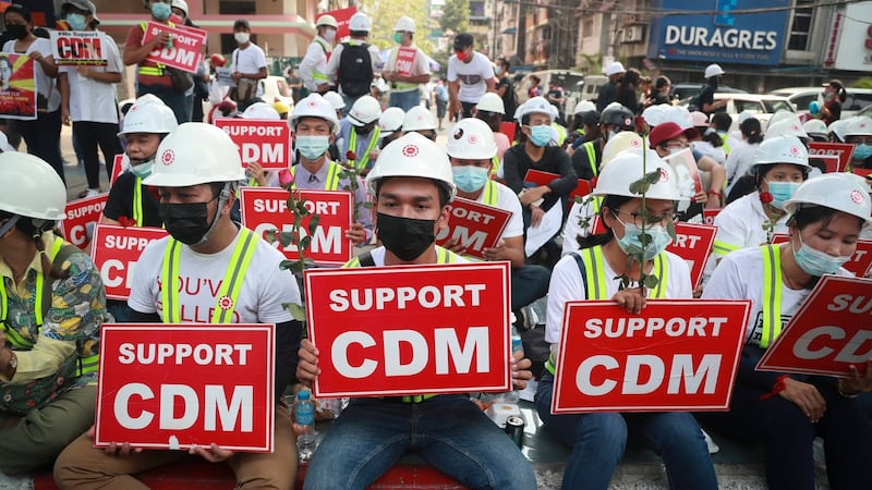 Demonstrators display placards in support of the civil disobedience movement against the coup. Photograph: AP Photo