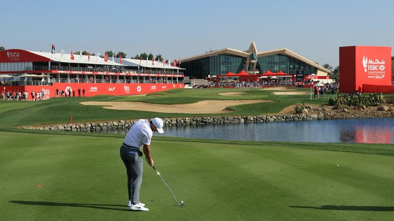Rory McIlroy plays his second shot on the 18th hole during round one of the Abu Dhabi HSBC Golf Championship. Photograph: Andrew Redington/Getty Images